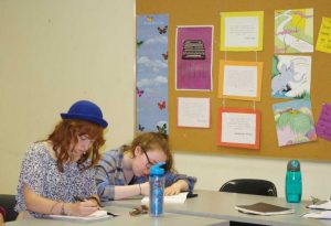 Girl Writing in a classroom