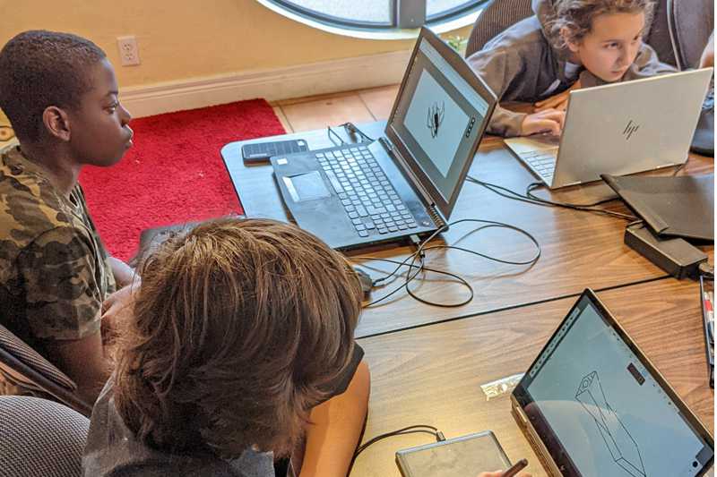 teens designing on computers at Centauri Arts, Bloor West Village, Toronto