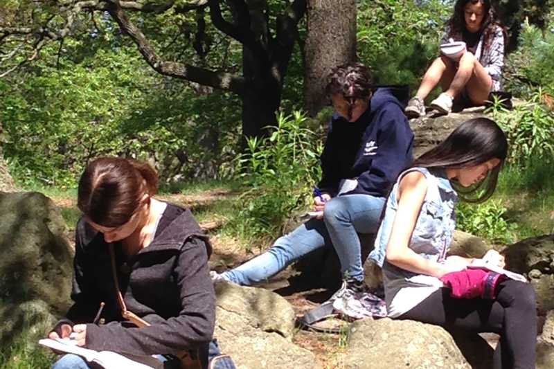 Centauri Arts Teenagers writing in the park