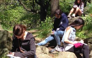 Centauri Arts Teenagers writing in the park